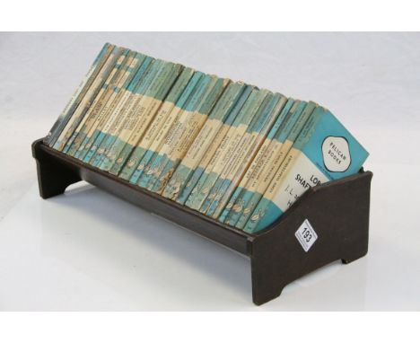 Early 20th century Oak Book Trough holding approximately 39 mainly 1930's Pelican Books with Blue and White Covers, titles in