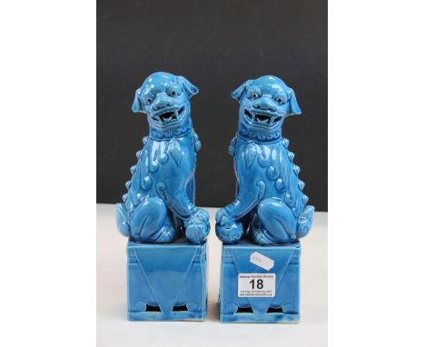 Pair of Oriental ceramic Dogs of Foo in blue ground glaze, 10" approx height  