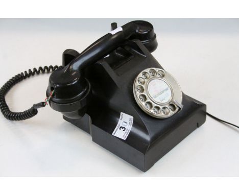 Mid to late 20th C Bakelite cased rotary dial telephone with Southampton code to centre 