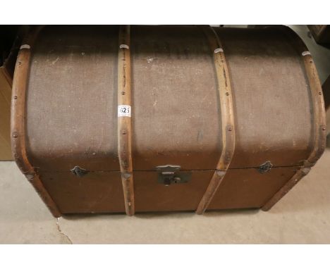 Early 20th century dome topped wooden bound luggage trunk containing a large quantity of unchecked jigsaw puzzles