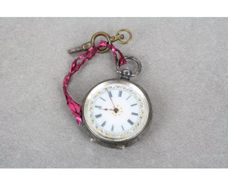 Silver fob watch, white enamel dial, black Roman numerals, gilt poker hands and applied gilt detailing, the case with engrave