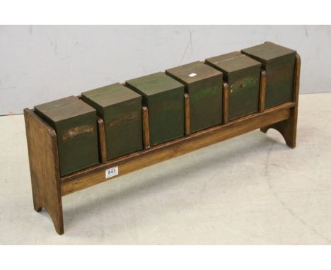 Vintage set of six herb tins housed in pine surround 