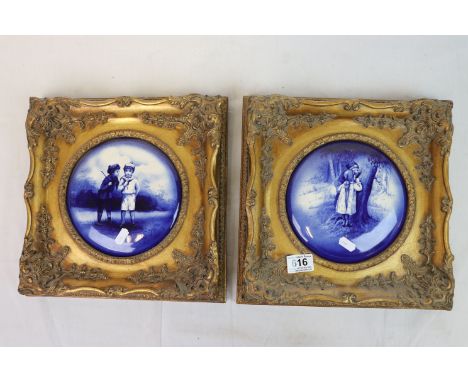 Pair of gilt framed blue and white, transfer printed ceramic plaques of children playing 