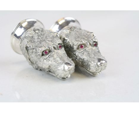 Pair of Condiments in the form of Dog's heads with Ruby coloured eyes, each approx 6cm tall