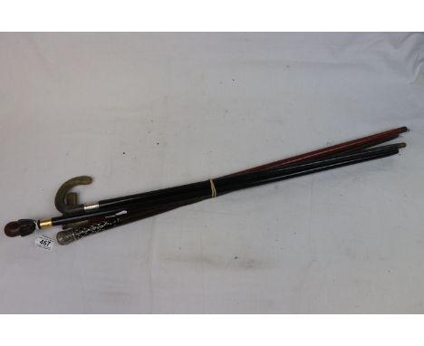 Early 20th century ebonized walking stick, silver mounted with horn handle, one other with horses head, a silver topped walki
