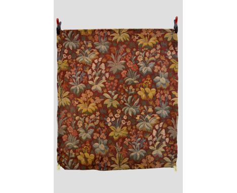 Hand woven wool hanging, light terracotta ground woven with all over flowering plants, probably English, early 20th century, 
