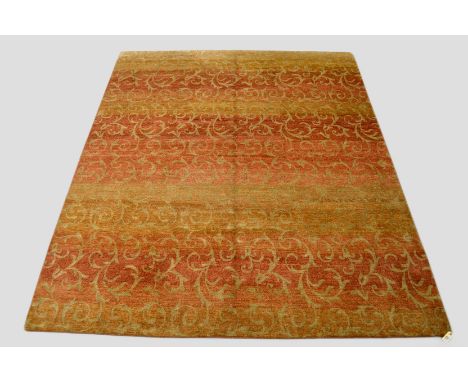 Attractive Nepalese pile carpet all over foliage design in soft shades of red and gold, 9ft. 9in. x 8ft. 2in. 2.97m. x 2.49m.