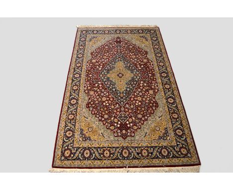 Hereke signed carpet, south west Anatolia, last quarter 20th century, 10ft. 7in. x 6ft. 5in. 3.23m. x 1.96m. Signed in top le