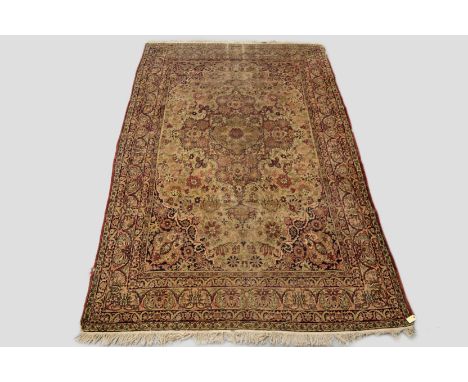 Kerman carpet, south west Persia, early 20th century, 10ft. 11in. x 7ft. 2in. 3.33m. x 2.18m. Overall wear; some damage to si