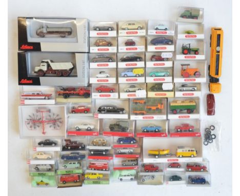 Collection of 56 boxed mostly plastic 1/87 scale OO gauge vehicle models from Wiking, Herpa, Brekina, Norev and Busch to incl