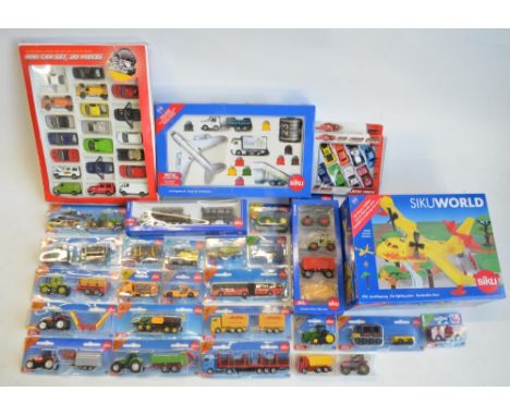 Twenty four boxed model sets from Siku to include diecast series models, a Siku World 1793 fire fighting plane set and 6312 a