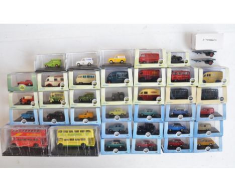 Thirty six boxed 1/76 scale OO gauge diecast vehicle models from Oxford Diecast to include Commercial, military, bus, Lotus a