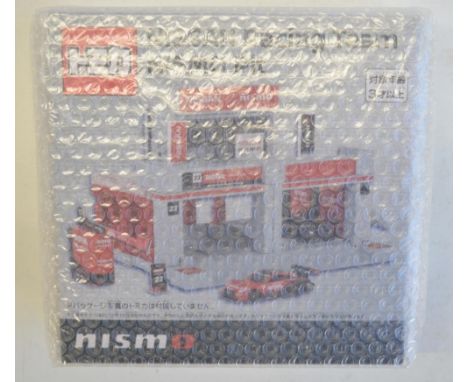 Tomica Town 1/64 scale Nissan racing team Nismo pit as new in original outer shipping bubble wrap, now rare and discontinued 