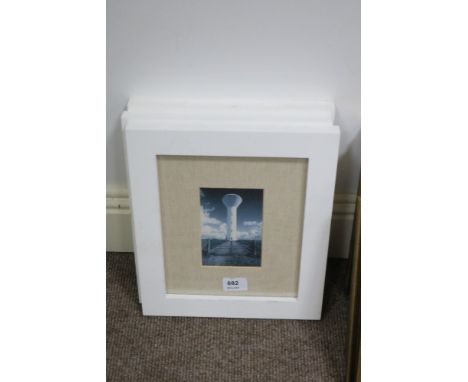 A SET OF THREE WHITE FRAMED PHOTOGRAPHS rock formation; wooden ladder and lighthouse (3)  each 25cm x 20cm