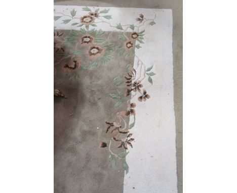 A GOOD WOOL RUG the off white and light brown field with central floral panel 295cm x 213cm 