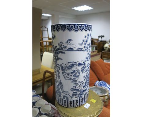 AN ORIENTAL STICK STAND the white ground decorated with figures in a landscape 46cm x 22cm