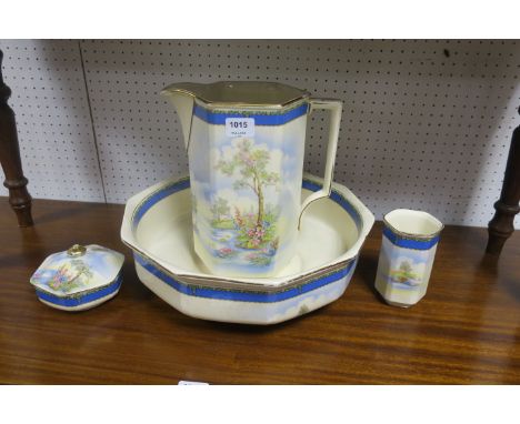 A FALCONWARE TOILET SET the white glazed porcelain transfer decorated with landscape scenes comprising a wash basin, water ju