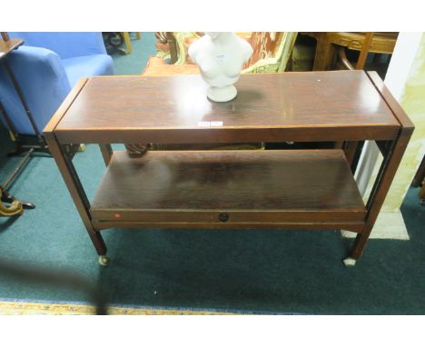 A MODERN TWO TIER BUFFET of rectangular form, with hinged lower shelf on square cut supports with castors 75cm x 117cm x 38cm