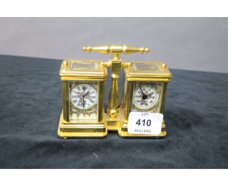 A CONTINENTAL STYLE GILT BRASS FRAMED MANTLE CLOCK AND WEATHER DIAL each in a rectangular case with white enamel dial decorat