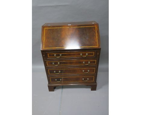 A GEORGIAN STYLE MAHOGANY AND SATINWOOD BANDED BUREAU the rectangular top above the faux front opening to reveal a fitted int