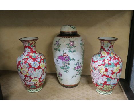 A MISCELLANEOUS COLLECTION including a pair of enamel glazed vases a pair of white porcelain posy vases a glazed porcelain mo
