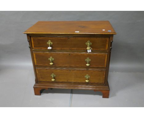 A GOOD GEORGIAN STYLE MAHOGANY CHEST rectangular top above three long drawers with satinwood crossed banding between canted a