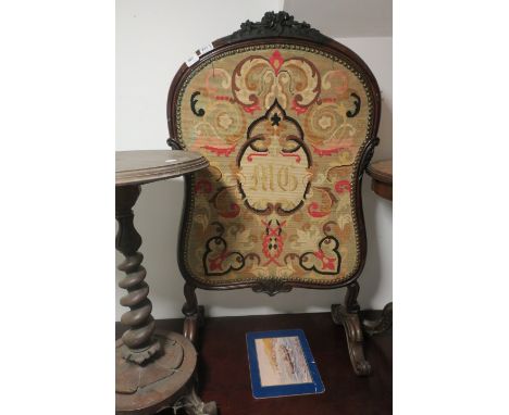 A MAHOGANY FRAMED FIRE SCREEN with a tapestry inset on splayed supports 111cm x 62cm