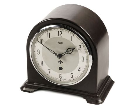 * Military Clock. WWII period Bakelite mantel clock by Smiths, Enfield, the arched case with circular silvered dial, black Ar