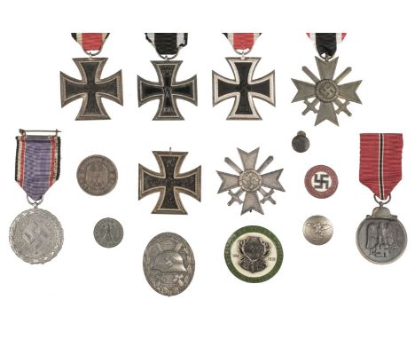 * Third Reich. Iron Cross 1939, Second Class (3), silver with iron centre, including one example stamped '4' on the suspensio