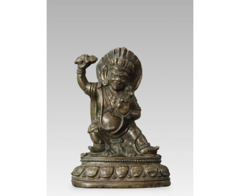 the wrathful Bodhisattva well modelled, standing in pratyalidhasana, the combative pose, on a lotus plinth, holding up the va