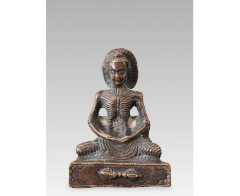 the dark bronze figure emaciated by prolonged austerities, well modelled seated in padmasana, with every rib and sinew define