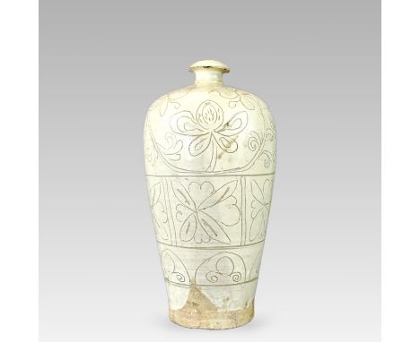 the tapering body carved through creamy-white slip with two broad bands of peony, all under a clear glaze except for the ungl