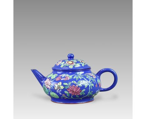 of compressed pear shape, the teapot and cover decorated on the exterior with a continuous design of  famille rose  birds, bu