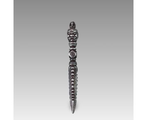 the ritual dagger crisply detailed, with the fierce fanged head of the guardian deity surmounted by an openwork vajra,.  Dime