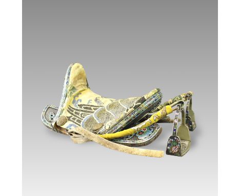 making up a very complete set, consisting of a saddle with stirrups, bridle and trappings, the saddle seat faced in yellow si