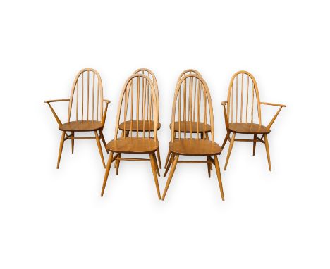 A set of six Ercol 'Quaker' style beech and elm dining chairs - including two with arms, the pointed arched spindle backs abo