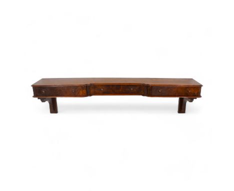 A mahogany wall shelf - with three drawers, height 27cm, width 112cm, depth 20cm.