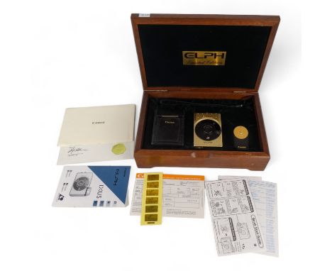 A Canon Elph Ixus IX240 gold plated limited edition camera - for Canon's 60th anniversary, camera and accessories in velvet l