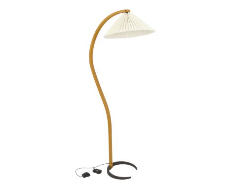 A contemporary Danish floor lamp by Mads Caprani - stamped to iron base, laminated wood stem, white pleated paper shade, 152c