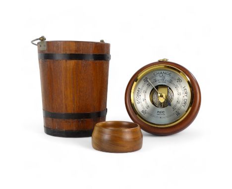 A late 20th century aneroid barometer - circular and mounted on a beech base, 20cm diameter, together with a coopered bucket 
