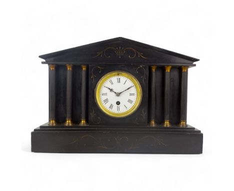 A late 19th century black slate portico clock - of typical form with an arrangement of six fluted columns flanking a white en