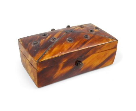 A 19th century tortoiseshell patch box - rectangular, the cover inlaid with silver wire and studs, 6cm wide.