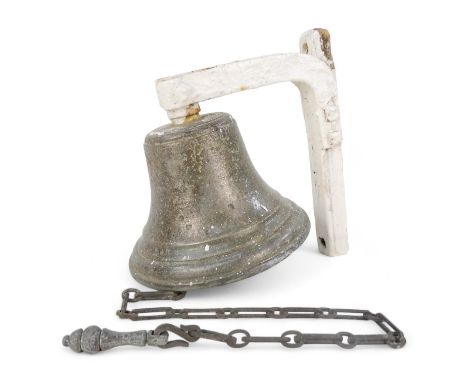 A vintage bronze bell - with a white painted bracket, 18cm high.