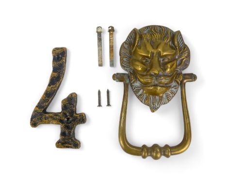 An early 20th century lion mask door knocker - 19cm high, together with a cast number 4. (2)