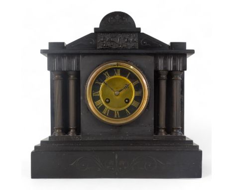 An early 20th century black slate mantel clock - of Palladian style with twin columns flanking a black chapter ring set out w