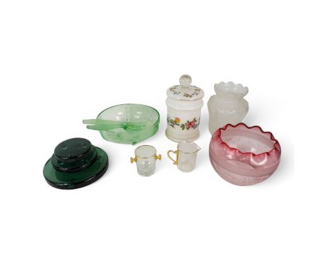 An Art Deco green glass bowl and salad servers - together with a set of three graduated green glass circular stands, a cranbe