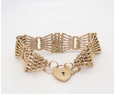 A 9ct gold wide gate bracelet with heart shaped clasp, length approx 18cm, width2cm, weight 29.7gms Condition Report:Availabl