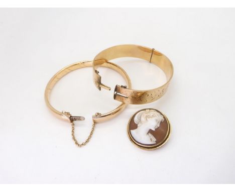 A 9ct gold twist pattern bangle, weight 12.6gms, together with a 14k gold mounted cameo pendant brooch weight 3.9gms, and a r