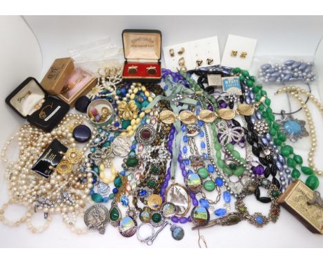 A collection of vintage costume jewellery to include, items by Miracle, farming badges, beads, brooches etc Condition Report: