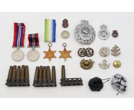 A WW2 Atlantic Star, 1939-45 Star and two War Medals, together with period bullet casings, black Bakelite RAF buttons, Argyll